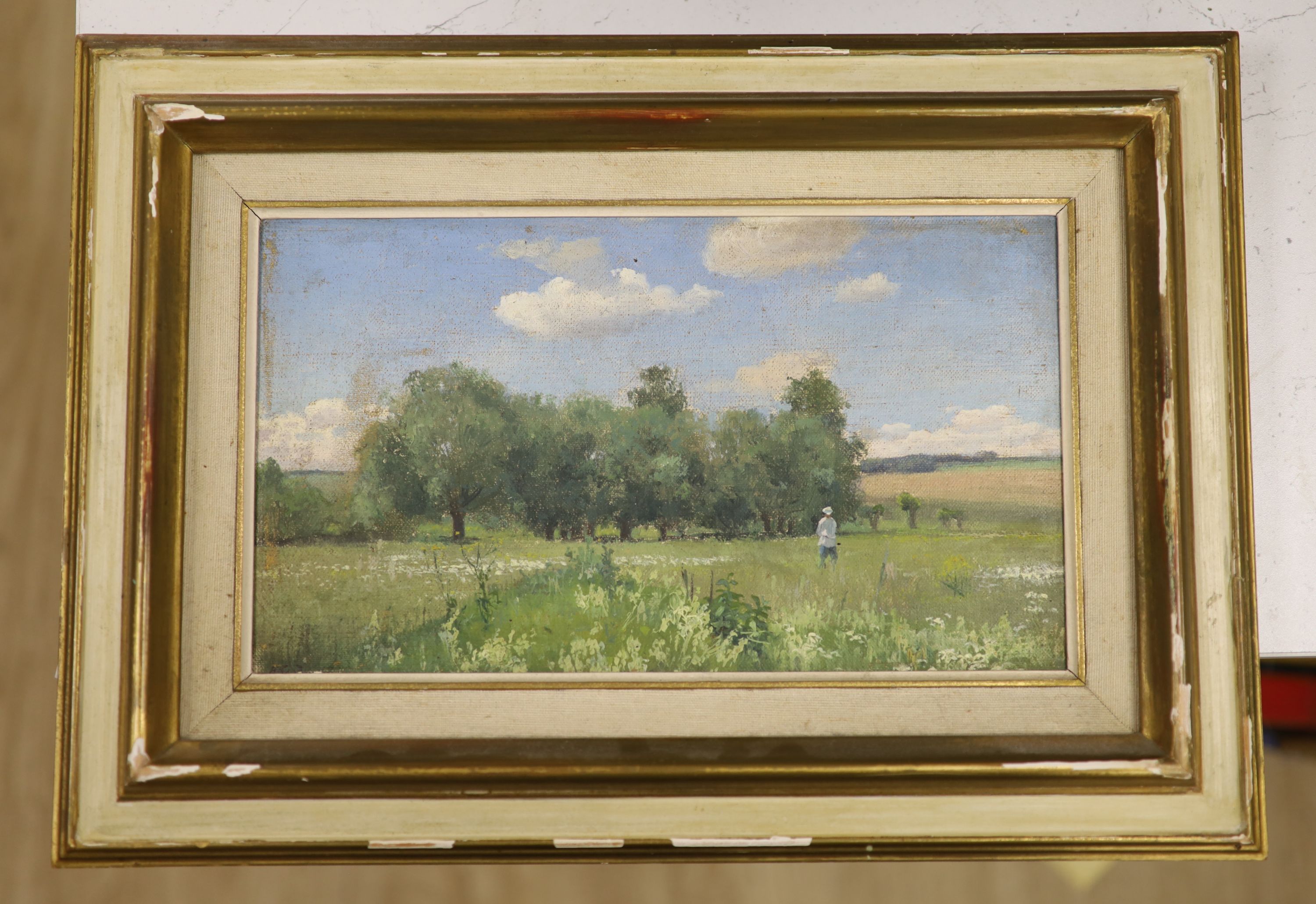 Russian School, oil on canvas board, Figure in a summer landscape, label verso, 17 x 29cm